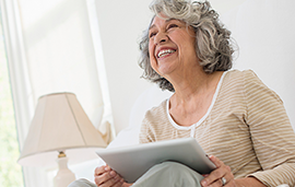 Woman smiling while reading